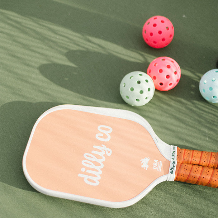 Dilly Co Carbon Fiber Pickleball Paddle with abstract court lines