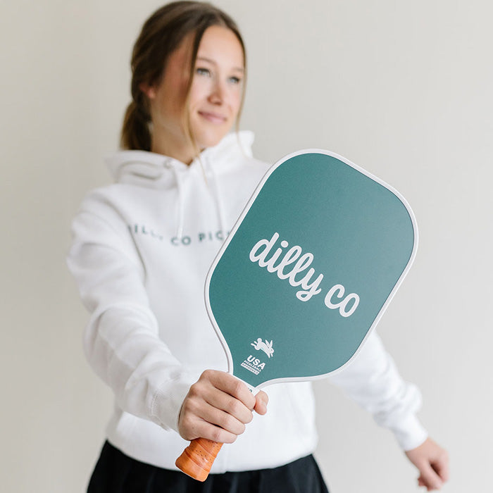 Girl holding Fiberglass Pickleball Paddle with Dilly Co "D" on Front