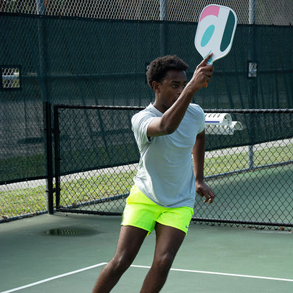 African American male using Dilly Co Fiberglass Paddle to serve